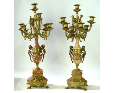 A pair of Louis XIV style seven branch candelabra, 20th Century design
The central column with polished granite segments, wit