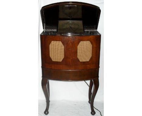 McMichael Ltd, Slough, Model 137 British Radio.
With two built in loudspeakers, walnut cabinet with stand released in May 193