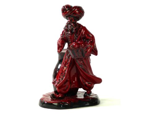 A Royal Doulton Flambé figure The Lamp Seller
HN 3278, printed factory marks to base, height 23cm.
 CONDITION REPORT: Lot 457