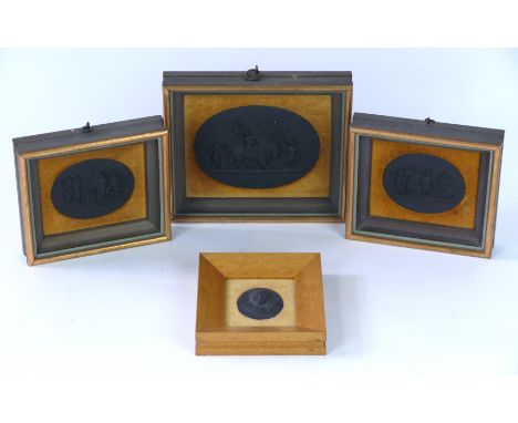 A collection of 19th Century black basalt relief moulded plaques
Each depicting a classical scene, adorned with putti emblema