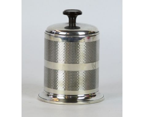 A George V hallmarked silver cigarette dispenser of cylindrical form
With engine turned decoration and Bakelite finial, Birmi