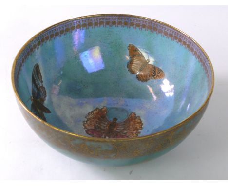 A Carlton Lustre Ware circular bowl
Decorated in the Armand pattern on a green ground, gilt printed marks to base, diameter 2