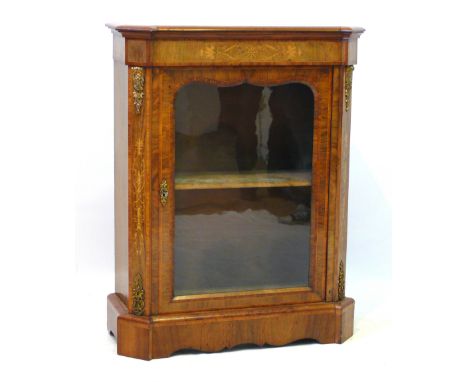 A Victorian marquetry inlaid figured walnut and walnut pier cabinet
The glazed and shaped panelled door enclosing a lined int