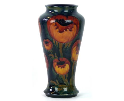 A fine William Moorcroft vase of tapering form decorated in the Big Poppy pattern
On an ochre ground, blue signature and date