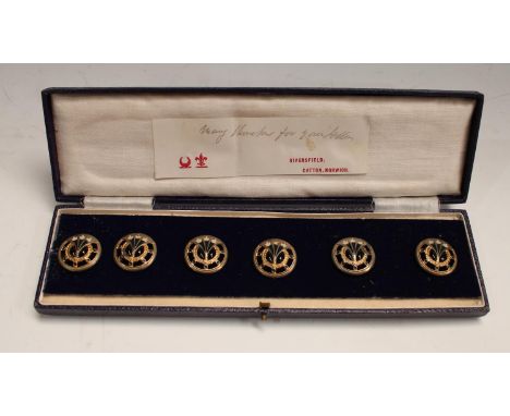 A set of early 20th century buttons, decorated in enamel with Scottish thistles