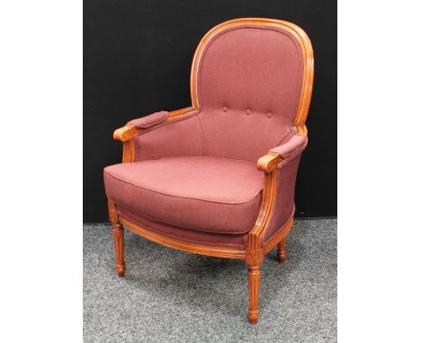 A contemporary French Transitional Louis XV/XVI design arm chair, shallow triple button back, bowed arms applied with manchet