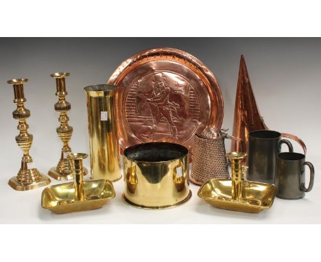 A pair of brass candlesticks, late 19th century; a copper Johnnie Walker bar tray; a copper funnel; a pair of brass chamber s