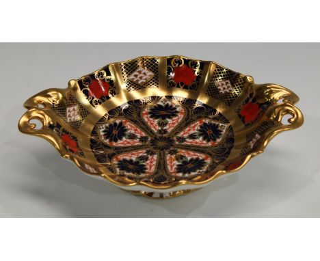 A Royal Crown Derby Imari palette 1128 pattern pedestal bon-bon dish, solid gold band, first quality, 16cm wide, printed mark