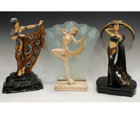 A Veronese Design resin Art Deco style model of a Dancing Girl, another similar, stepped black base, an Art Deco style table 