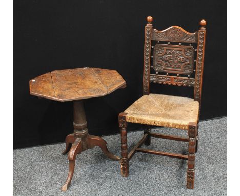 A 19th century oak tripod occasional table, octagonal top, canon-barrel column; a hall chair, carved in the 17th century tast