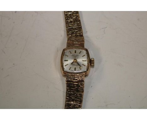 A lady's 9ct gold rotary wristwatch, square dial, baton indicators, integral 9ct bracelet strap, marked 375, 15.6g