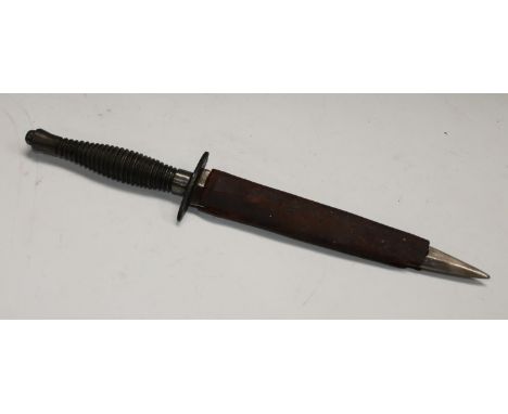 A Fairbairn Sykes 3rd pattern fighting knife, of unusual variation, the grip steel rather than alloy, partial scabbard Refere