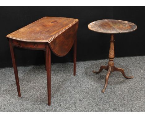 A George III mahogany Pembroke table, near-circular top with fall leaves, above a single frieze drawer, tapered square legs; 
