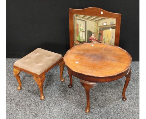 An early/mid 20th century walnut quarter veneered shaped circular coffee table; an oak framed fire screen, needlepoint cottag