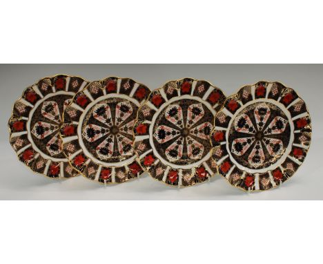 A set of four Royal Crown Derby 1128 pattern shaped circular dessert plates, 21.5cm diam, first quality  Condition Report: Go