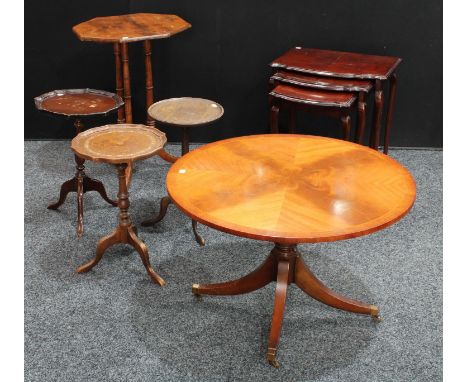 A Regency style low circular occasiontal table; three similar wine tables; an octagonal triple-column tripod occasional table