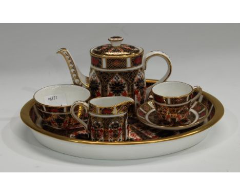 A Royal Crown Derby Imari palette 1128 pattern miniature cabaret set on tray, comprising teapot, milk and sugar, teacup and s