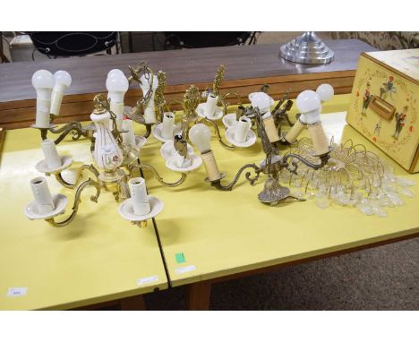 A group of 20th Century brass framed ceiling lights and wall sconces plus a further light fitting with glass drapes