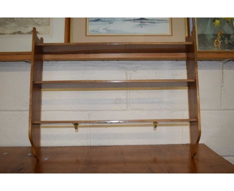 A mahogany three tier shelf unit