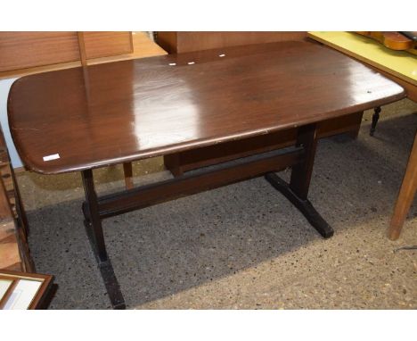 A retro Ercol dark elm dining table