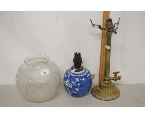 A brass based table lamp with frosted glass shade together with a further small table lamp formed from a prunus pattern ginge