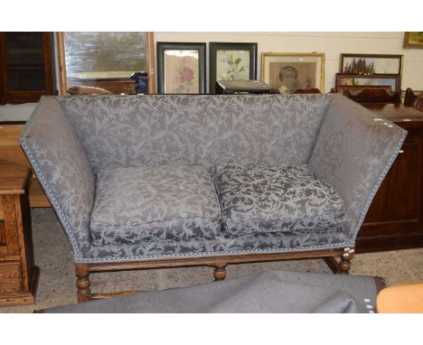 A 20th Century oak framed sofa with blue upholstery