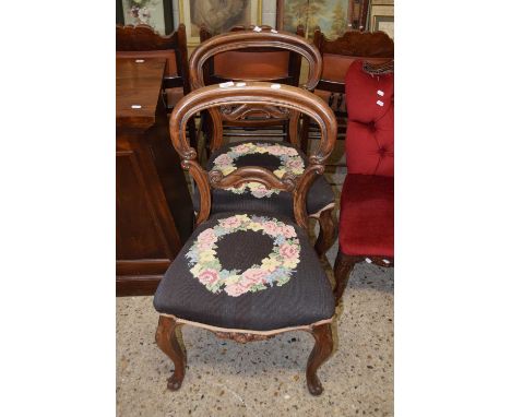 A pair of Victorian balloon back dining chairs with floral tapestry seats