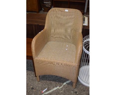 A Lloyd Loom wicker armchair
