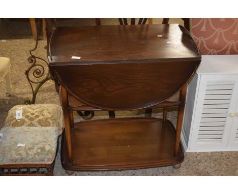 A dark Ercol tea trolley with drop leaves