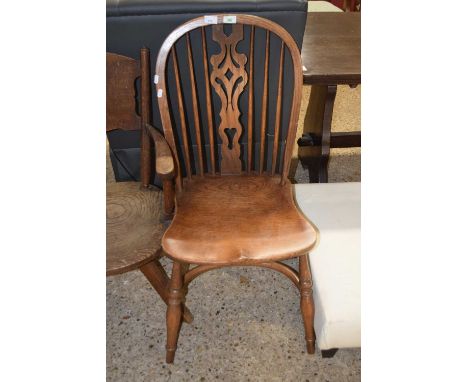 An elm seated stick back dining chair with crinoline stretcher