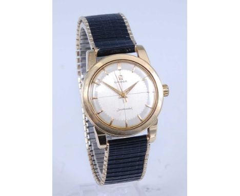 A vintage gents Omega Seamaster gold plated wrist watch having a signed silvered dial with baton markers, manual wind movemen