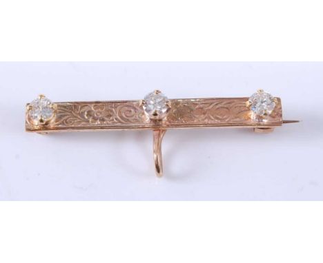 A 9ct yellow gold diamond bar brooch, comprising three round brilliant cut diamonds in four-claw settings, with an engraved f