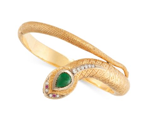 A JADEITE JADE, DIAMOND AND RUBY SNAKE BANGLE in 18ct yellow gold, designed as a coiling snake, the head is set with a pear s
