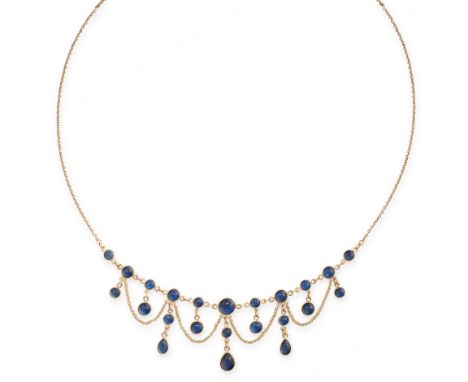 VINTAGE SAPPHIRE NECKLACE in yellow gold, in fringe design, comprising of a row of cabochon sapphires suspending further sapp