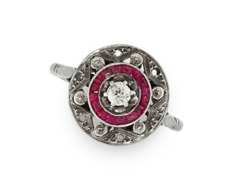 ART DECO RUBY AND DIAMOND TARGET RING the circular face is set with an old cut diamond in a border of step cut rubies and fur