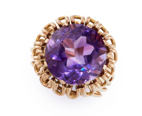 VINTAGE AMETHYST RING comprising of a round cut amethyst in open wirework border, unmarked, size M / 6, 10.3g.