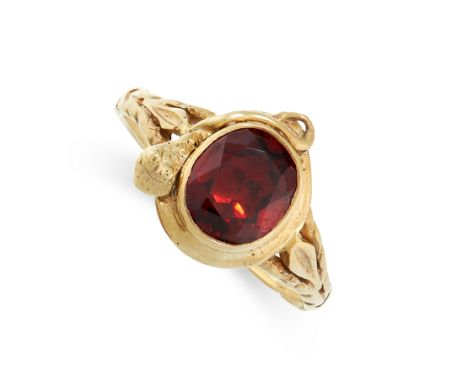 ANTIQUE GEMSET SNAKE RING in yellow gold, set with a central foiled back oval cut red gemstone with a snake wrapped around it