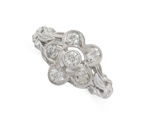 DIAMOND RING in the form of a flower, set with old cut diamonds totalling 0.6-0.7 carats, unmarked, size O / 7, 5.8g.