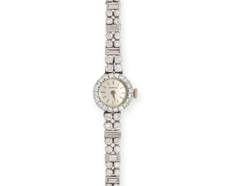 VINTAGE DIAMOND LADYS WRISTWATCH, VERTEX in 9ct white gold, the white dial is set in a border of round cut diamonds, with fur