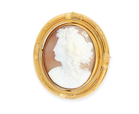 ANTIQUE CAMEO MOURNING LOCKET BROOCH set with a rotating carved shell cameo depicting the best of a classical lady with a gla