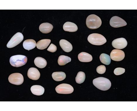 Approx 44ct of semi polished opal cream / beige 