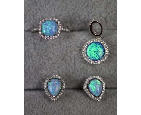 Silver and opal ring together with silver and opal pendant and earrings 