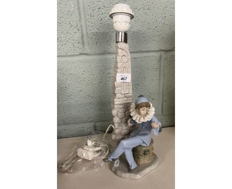 A Lladro 'Nao'&nbsp; porcelain figural table lamp with a boy in clowns costume playing a mandolin sat on a tree stump against
