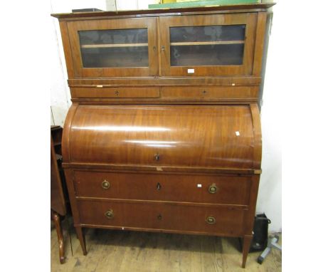 19th Century Continental mahogany cylinder bureau cabinet, the superstructure with two small glazed doors above two shallow d