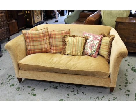 Kingcombe Chelsea two seater sofa, covered in Colefax and Fowler biscuit fabric, raised on low square tapering supports180cm 