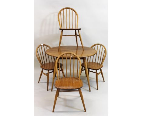 Mid 20th Century Ercol dining room suite comprising:  an oval elm table, 99cms x 88cms, set of four stickback chairs and a si