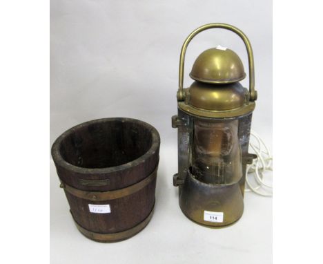 Ship's brass mast head lamp, together with a teak and iron bound bucket constructed from timbers from HMS Ironduke 