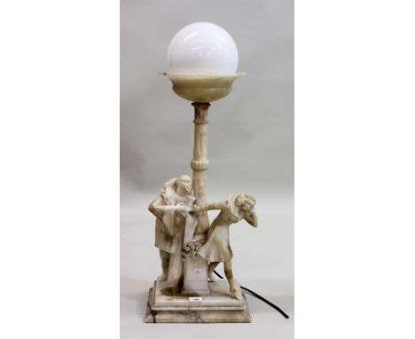 Early 20th Century carved alabaster table lamp, the opaque glass ball form shade above a tulip carved column support with fig