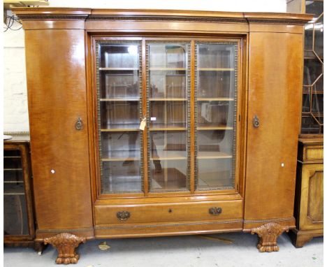 Large early 20th Century Continental walnut side cabinet, the moulded cornice above a centre section with glazed panel doors 