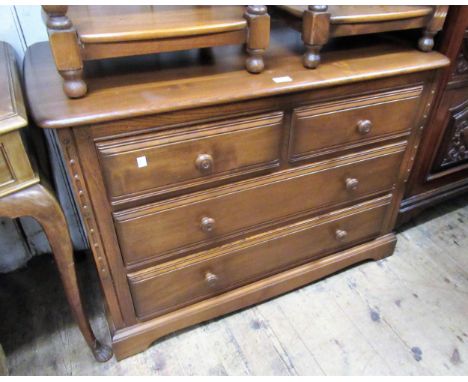 Ercol chest of two short and two long drawers with knob handles, 100cms wide together with a similar open bookcase, 93cms wid